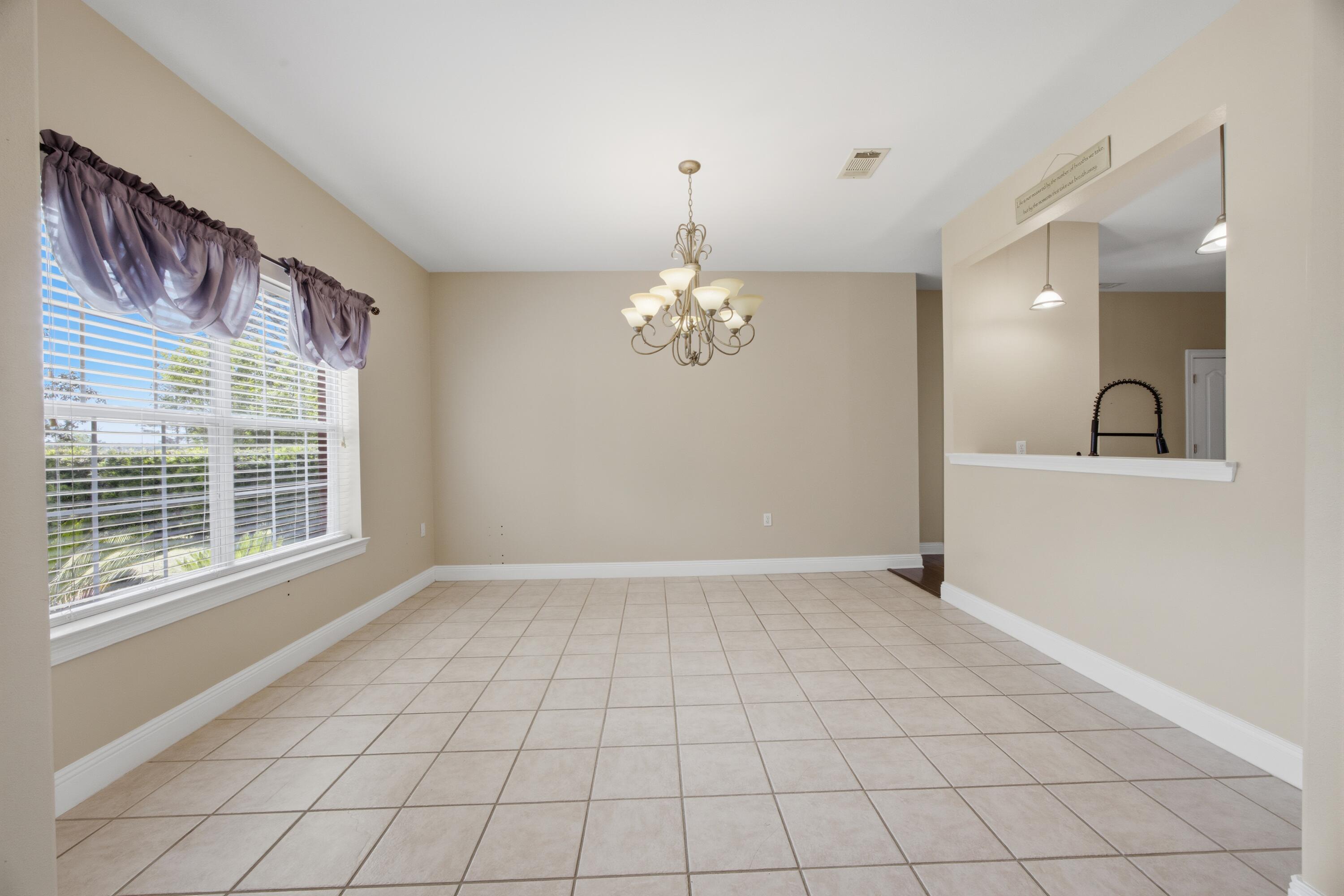 51 Tournament Lane Freeport, FL 32439 - Photo 22 of 71 a view of an empty room with a window