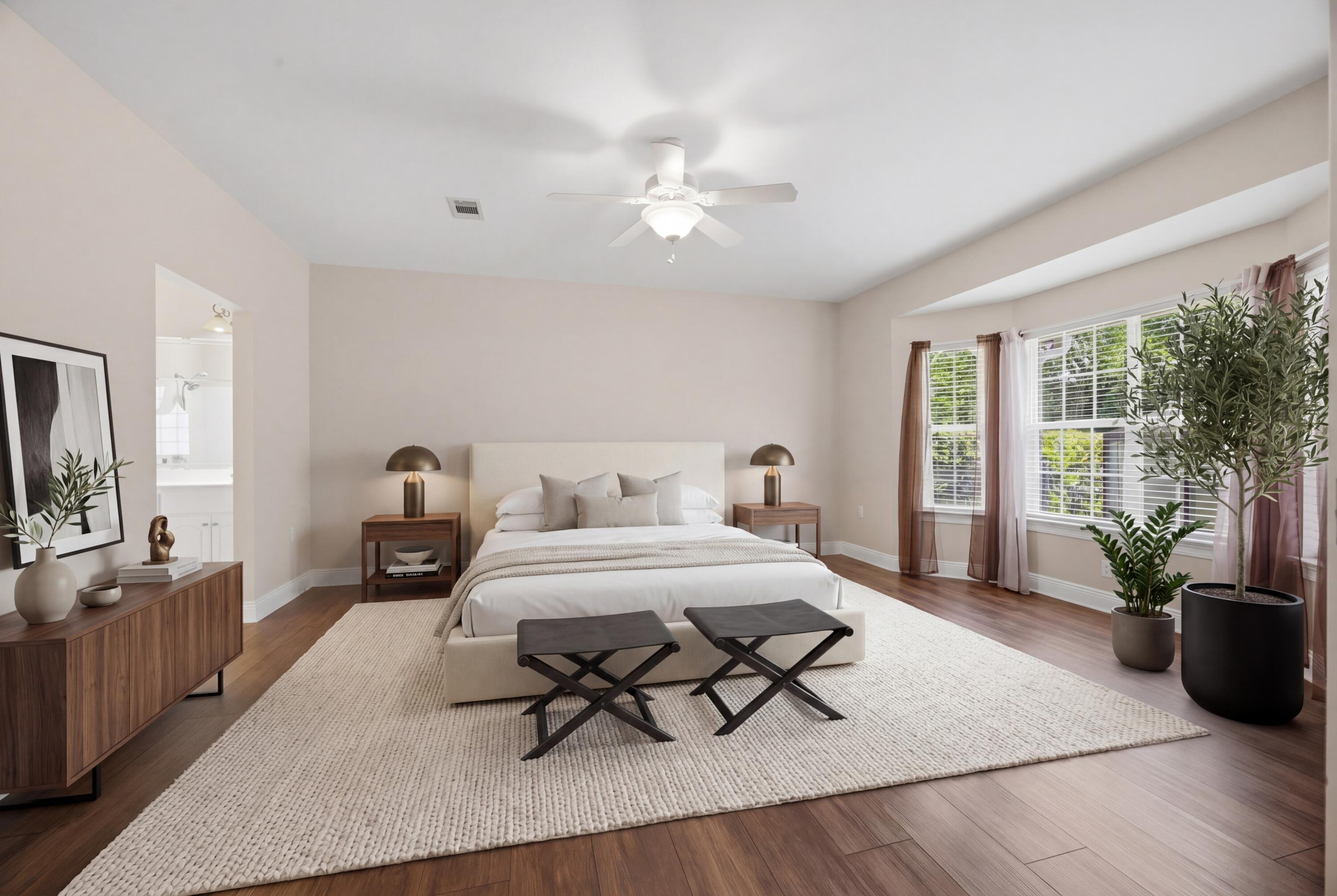 51 Tournament Lane Freeport, FL 32439 - Photo 34 of 71 a spacious bedroom with a bed a chandelier and window