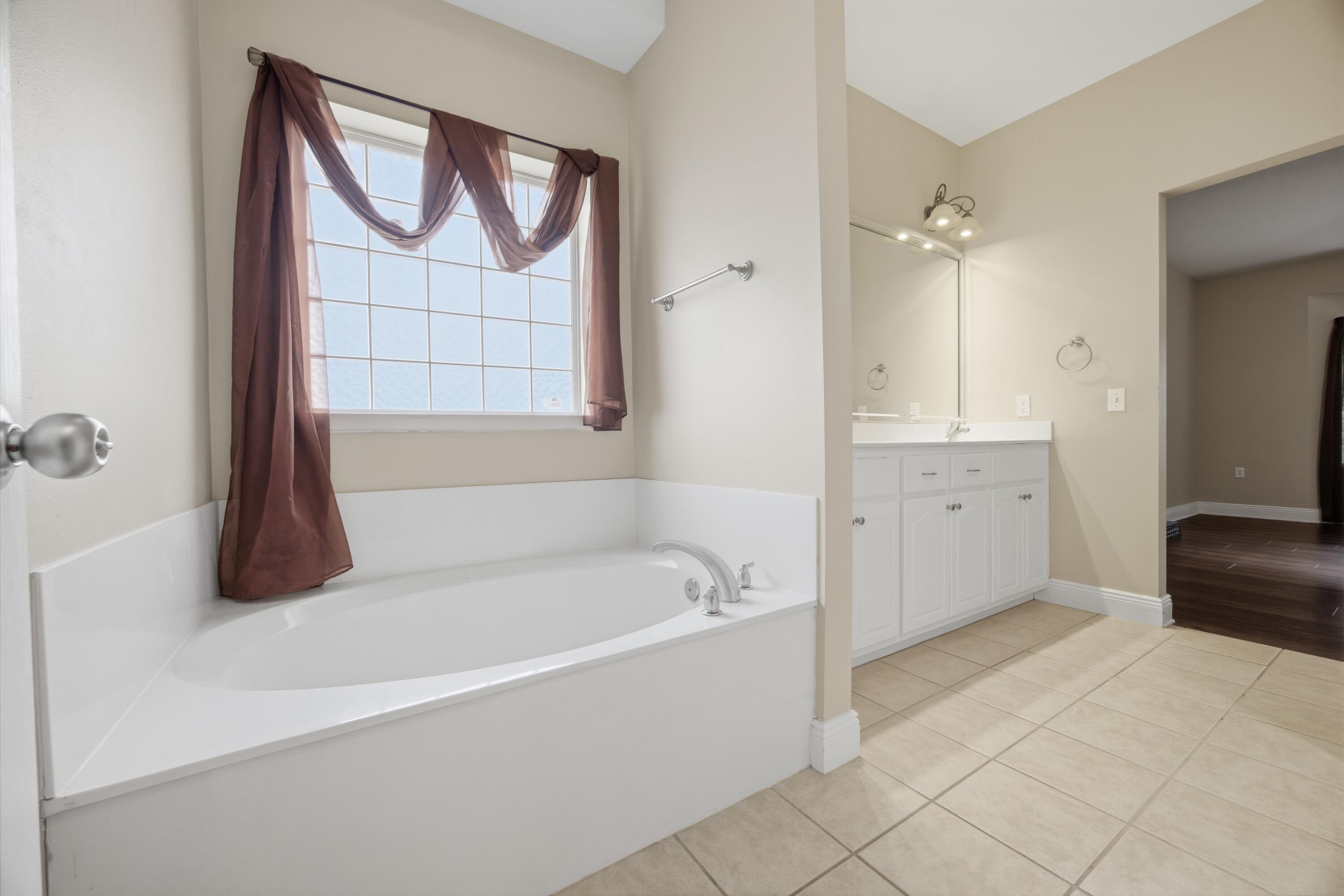 51 Tournament Lane Freeport, FL 32439 - Photo 44 of 71 a bathroom with a bathtub and a shower