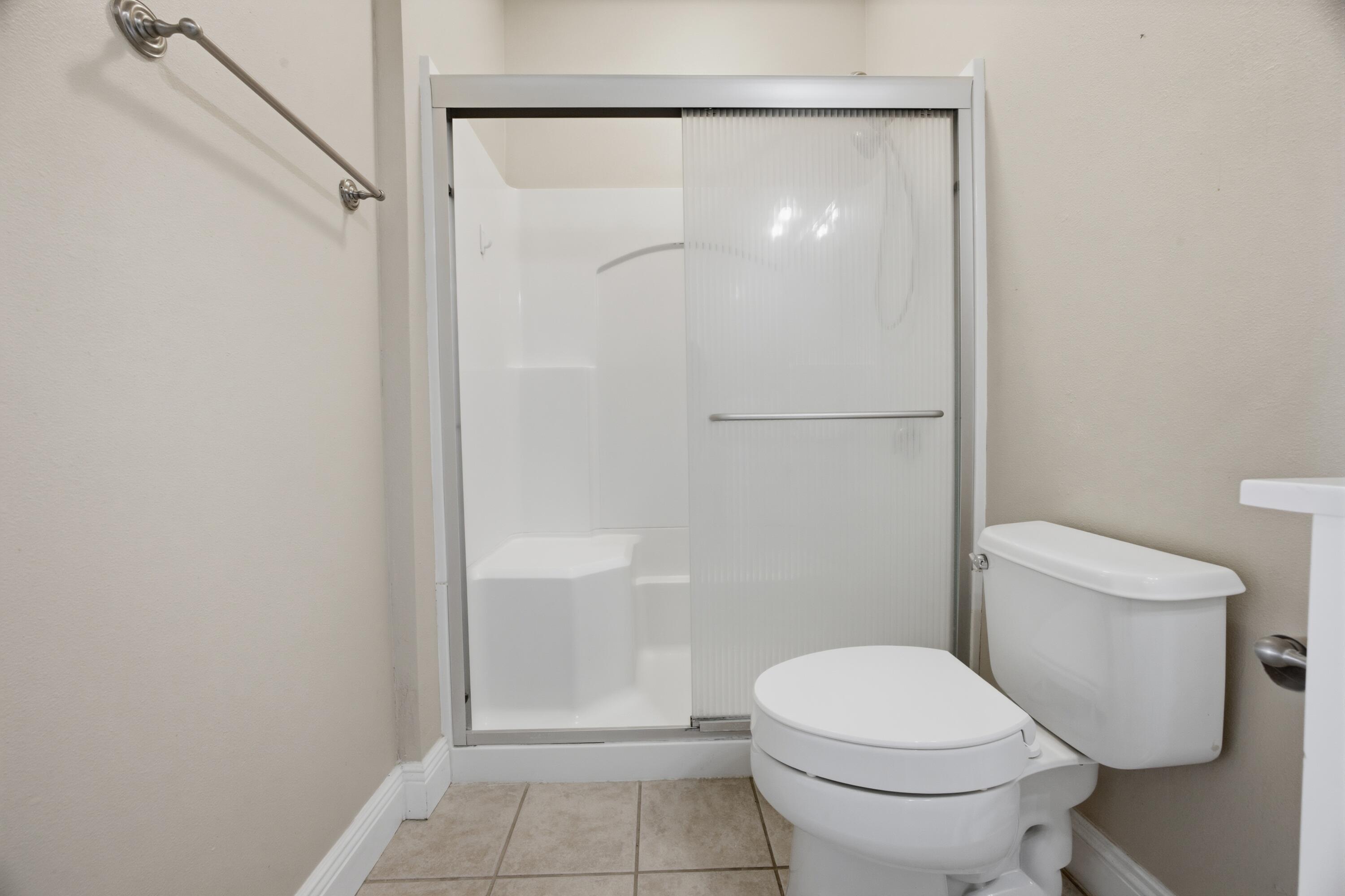 51 Tournament Lane Freeport, FL 32439 - Photo 55 of 71 a bathroom with a toilet and a shower