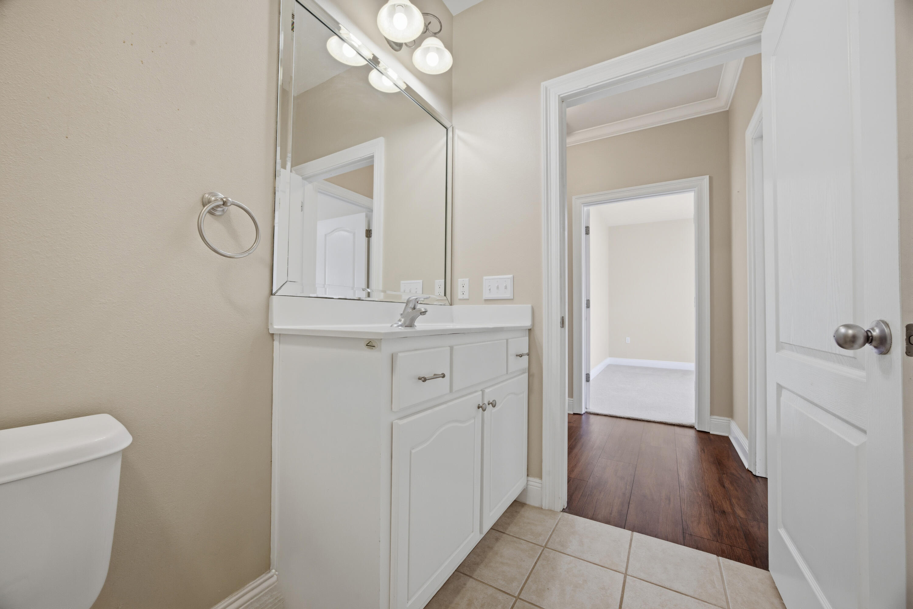 51 Tournament Lane Freeport, FL 32439 - Photo 56 of 71 a bathroom with a sink a toilet and a mirror
