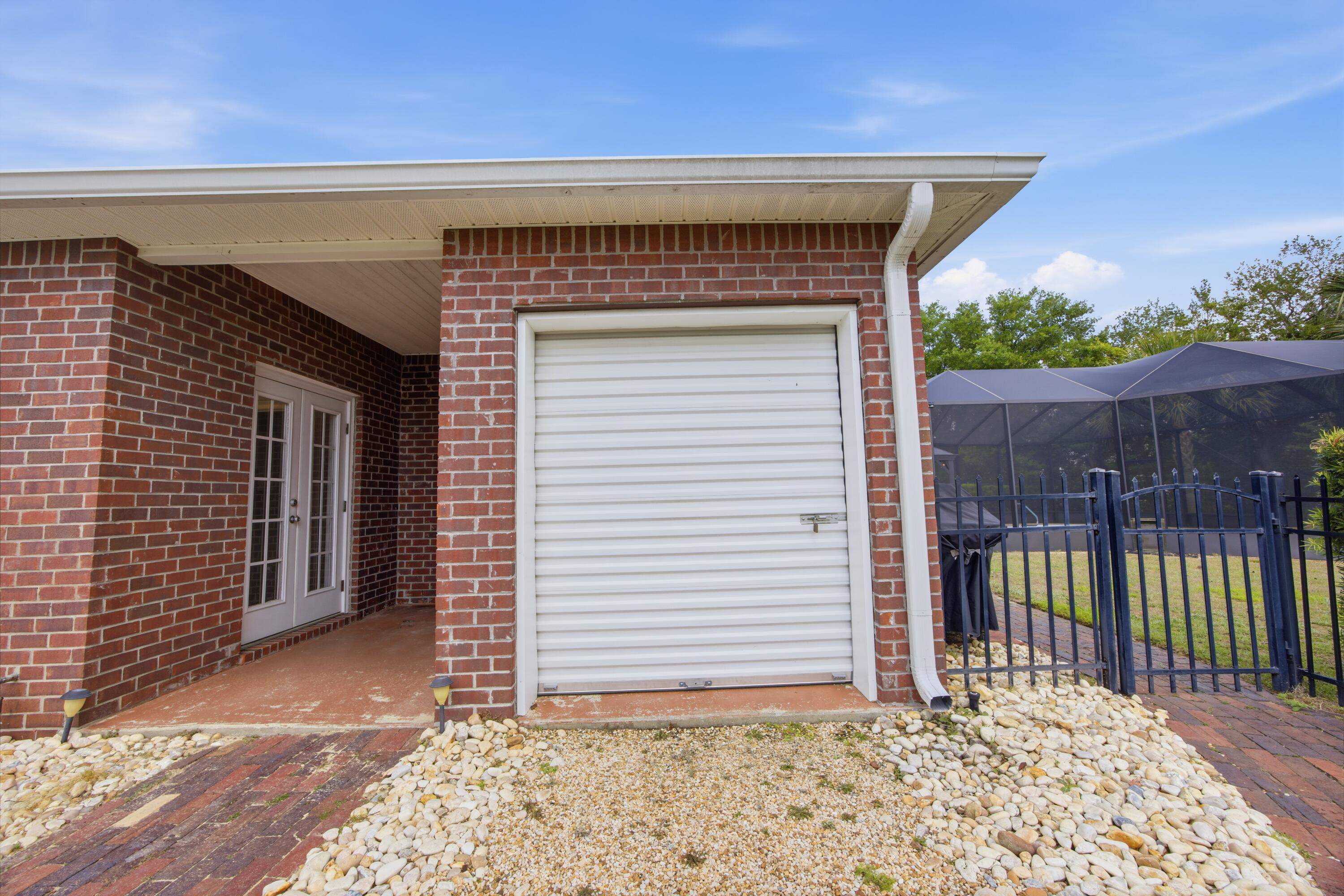 51 Tournament Lane Freeport, FL 32439 - Photo 66 of 71 a view of a house with a small yard and wooden floor and fence