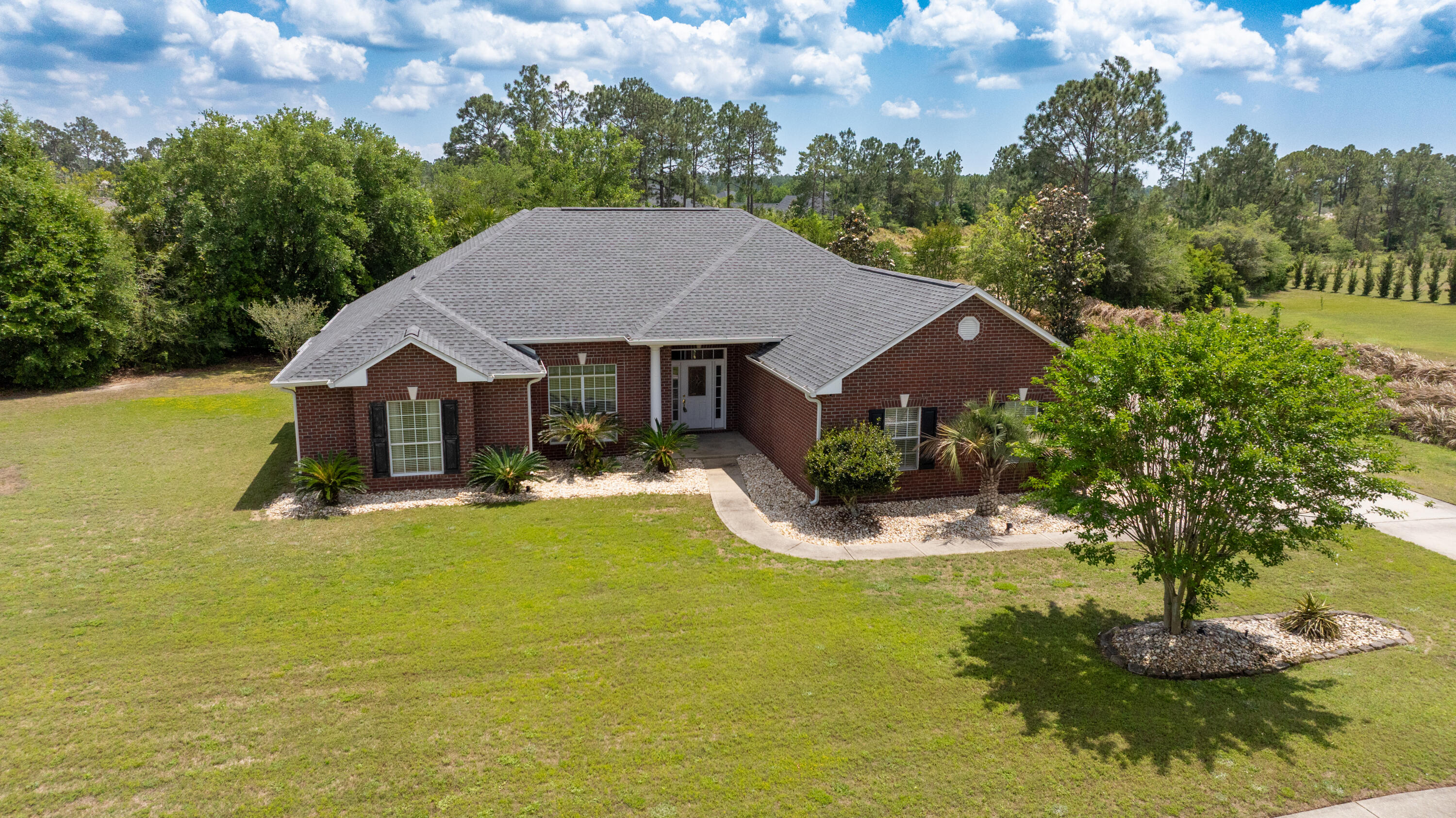 51 Tournament Lane Freeport, FL 32439 - Photo 8 of 71 a aerial view of a house with swimming pool and big yard