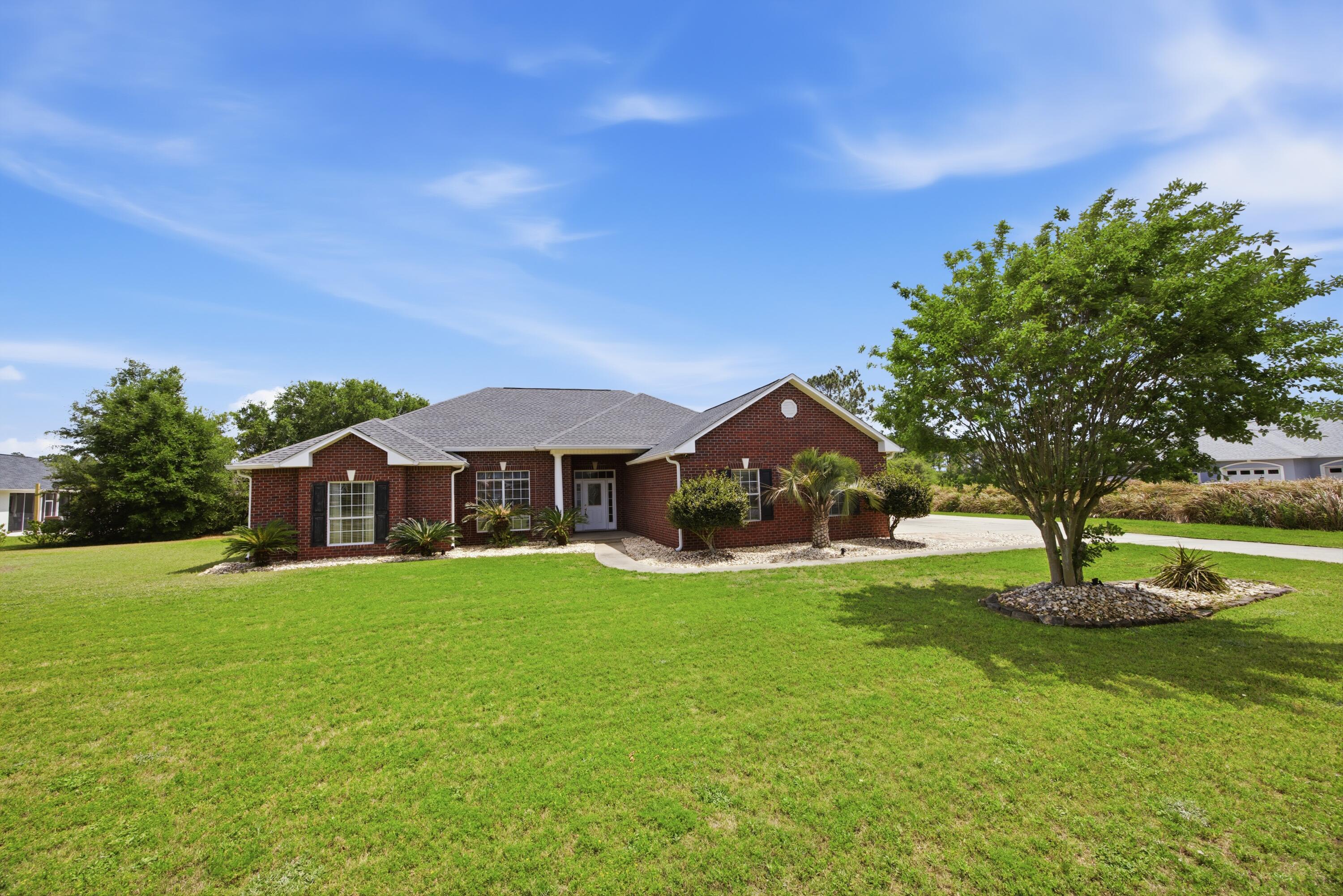 51 Tournament Lane Freeport, FL 32439 - Photo 9 of 71 a view of a house with a big yard