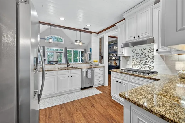 a living room with a bed furniture and a window