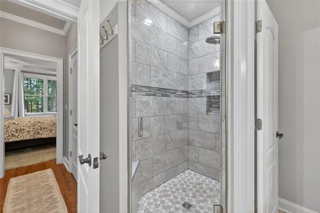 a living room with stainless steel appliances kitchen island a table and a chairs in it