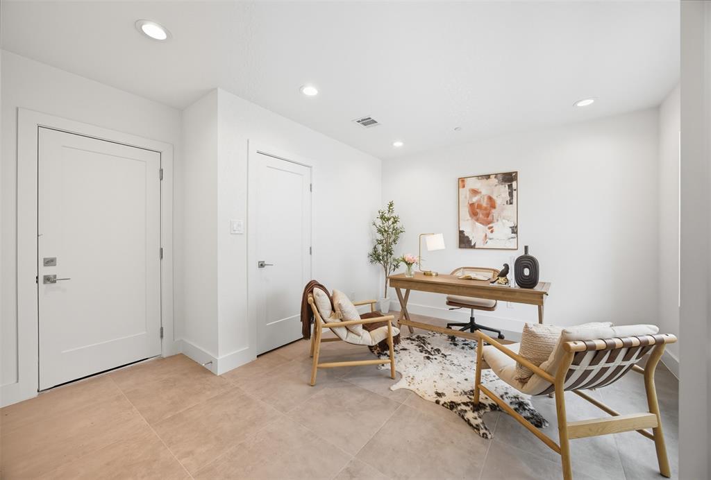 4517 Munger Avenue, Unit 101 Dallas, TX 75204 - Photo 35 of 39 a workspace with furniture and a fan