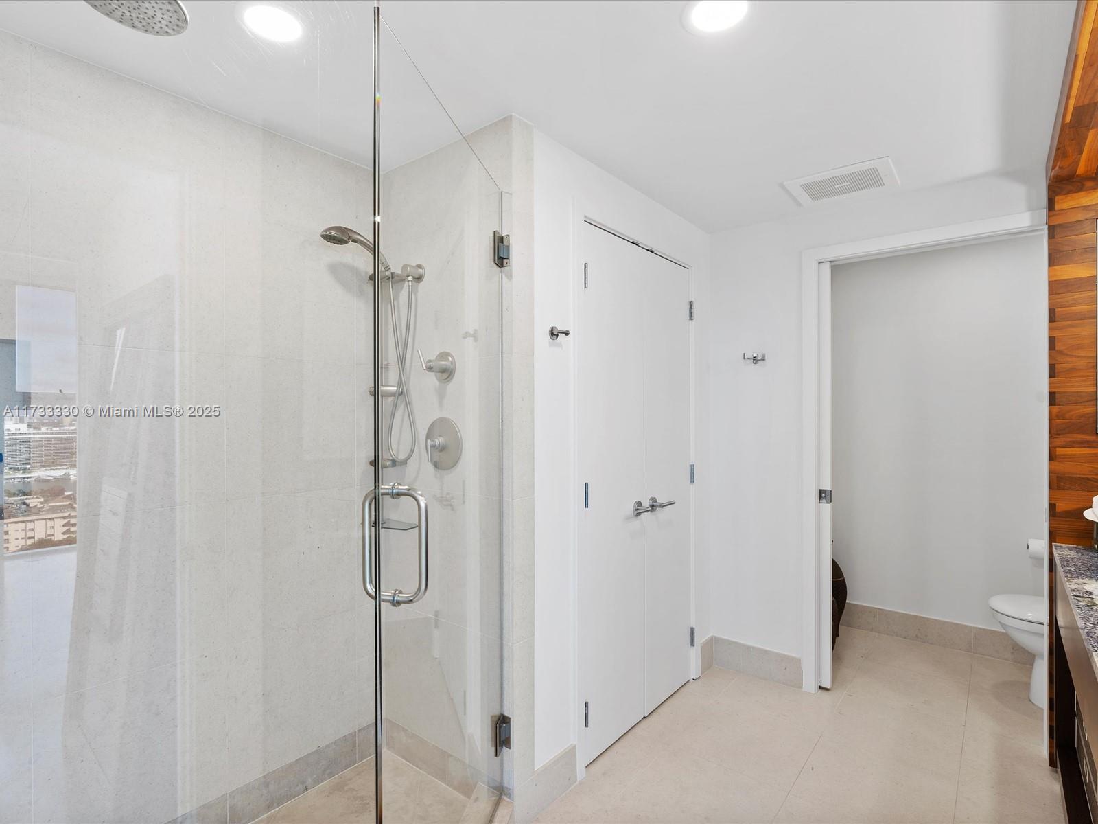 6899 Collins Avenue, Unit 1704 Miami Beach, FL 33141 - Photo 20 of 25 a bathroom with a shower