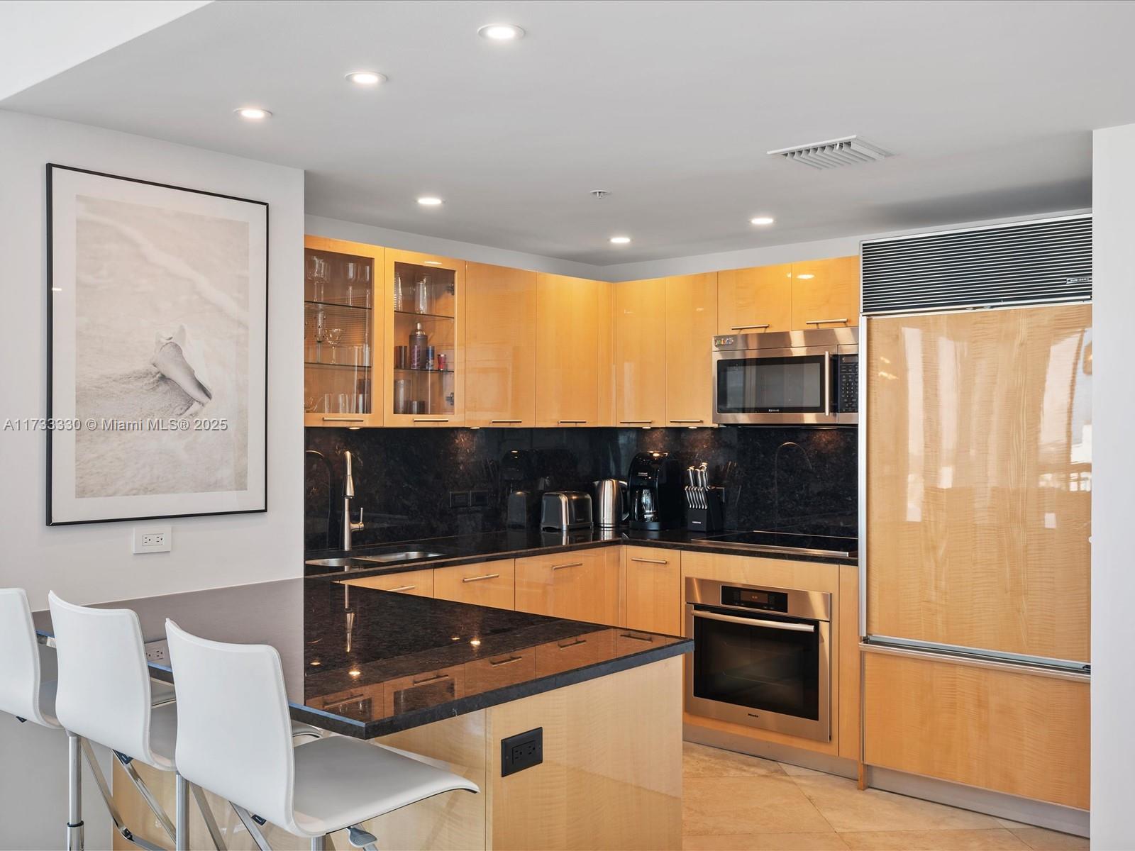 6899 Collins Avenue, Unit 1704 Miami Beach, FL 33141 - Photo 5 of 25 a room with table tennis and air hockey table