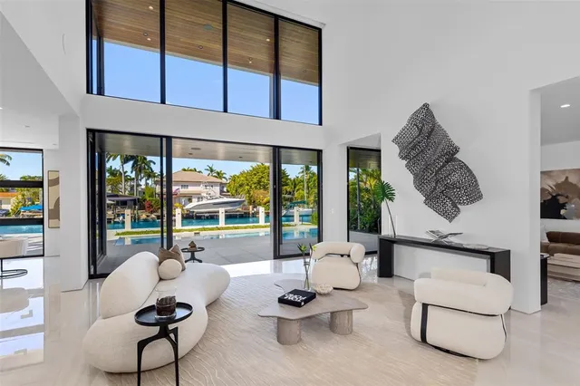 a bedroom with a large bed and a large window