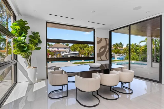 a swimming pool with a yard and palm trees