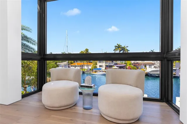 a view of swimming pool with outdoor seating and yard in the back