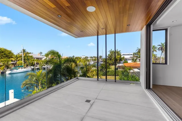 a view of entrance gate of house and car parked