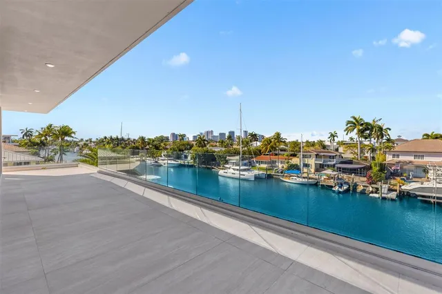a view of a lake with boats and trees in the background