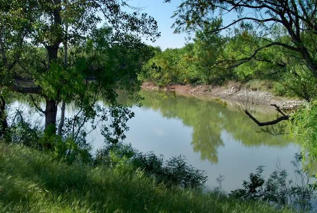 a view of lake with green space