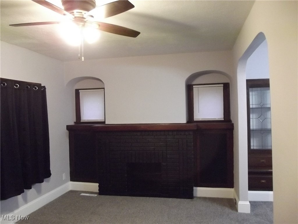 3904 Snow Road Cleveland, OH 44134 - Photo 4 of 50 Empty room featuring carpet floors and ceiling fan