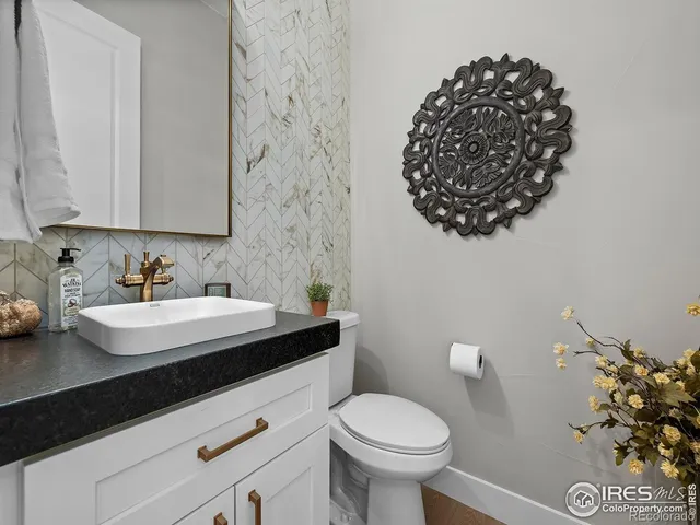 a bathroom with double vanity and a shower