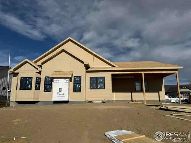a view of a house with brick wall and roof