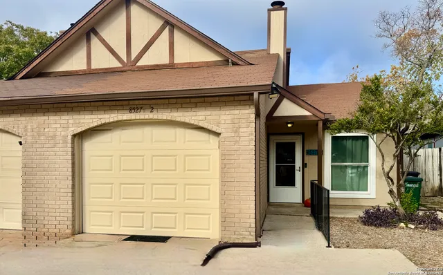 a front view of a house with a garage