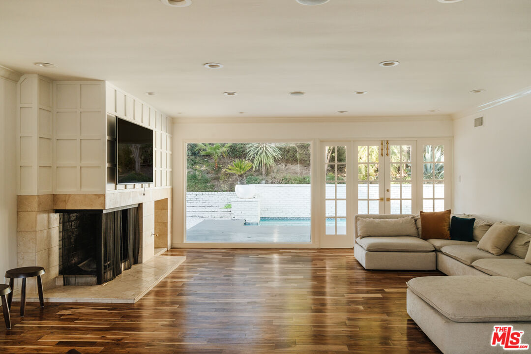10101 Angelo Circle Beverly Hills, CA 90210 - Photo 3 of 7 a living room with fireplace furniture and a flat screen tv