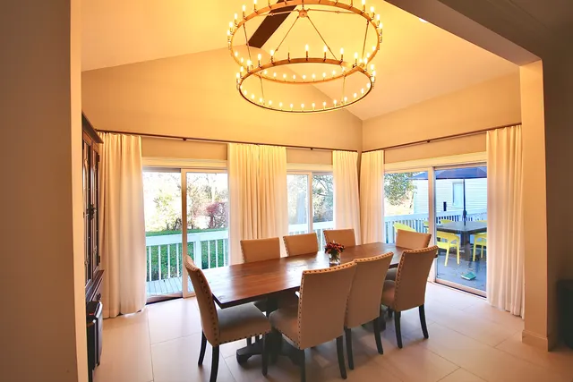 a view of a dining room with furniture window and outside view