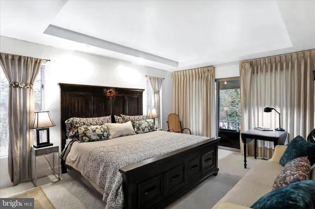 a spacious bedroom with a bed and a window