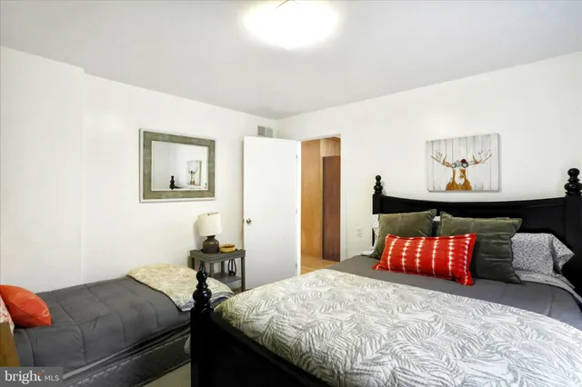 a bedroom with a bed and window