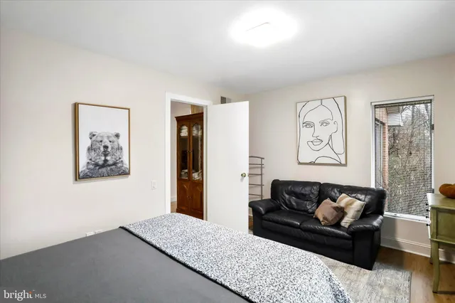 a living room with furniture and a painting