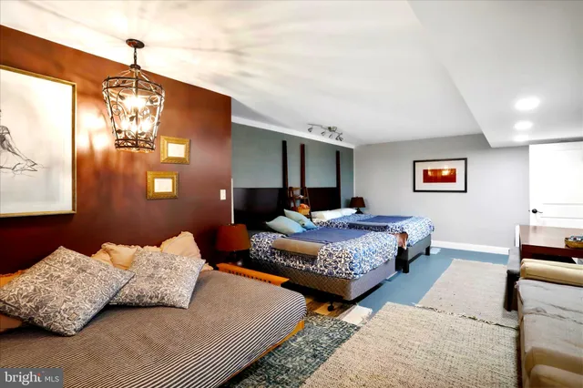 a bedroom with bed and window