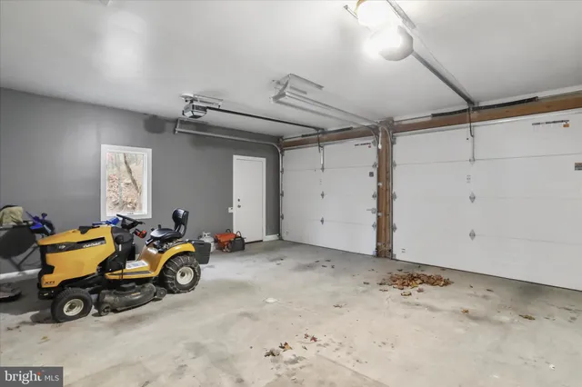 a view of a garage with parked cars