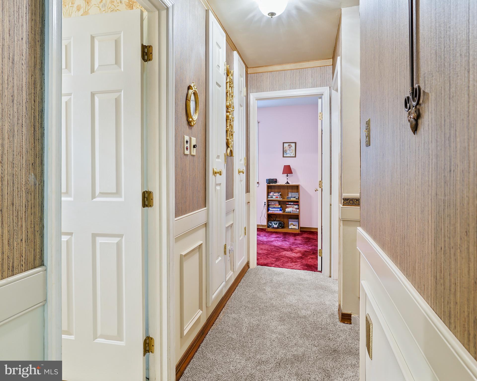 255 Chestnut Springs Road Chesapeake City, MD 21915 - Photo 37 of 42 Upper hallway with more built-in storage cabinets.