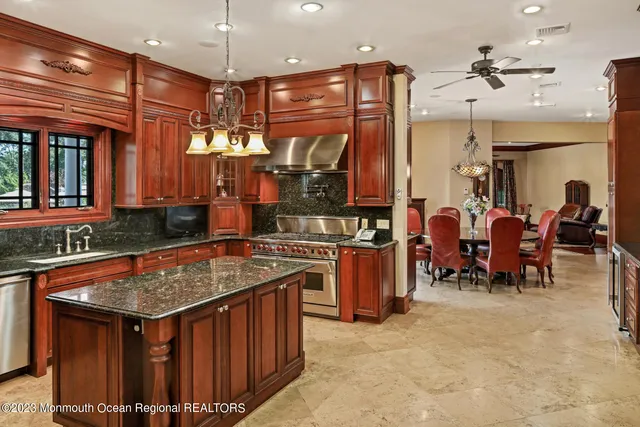 a bedroom with a bed a flat tv screen and a fireplace