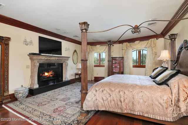 a bedroom with a bed and a mirror