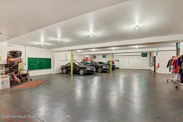 a view of a house with a big yard and a fountain