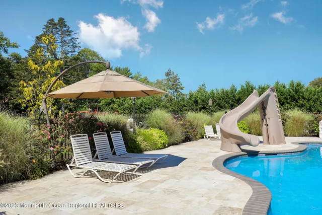 a view of a swimming pool with a patio