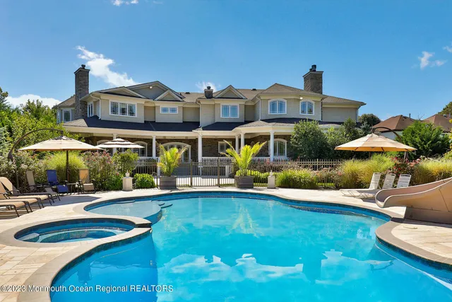 a view of a swimming pool with a patio