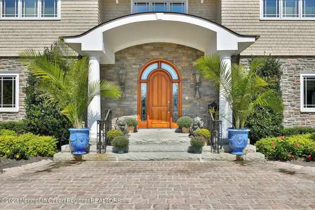 a front view of a house with outdoor seating