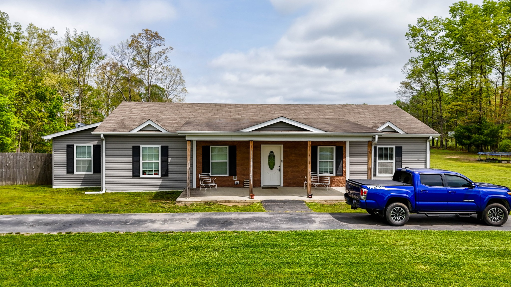 a view of a house with swimming pool and porch