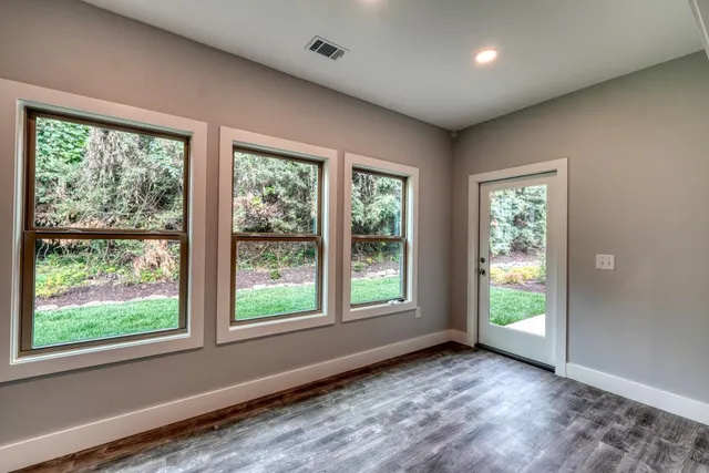 a view of an empty room with a window