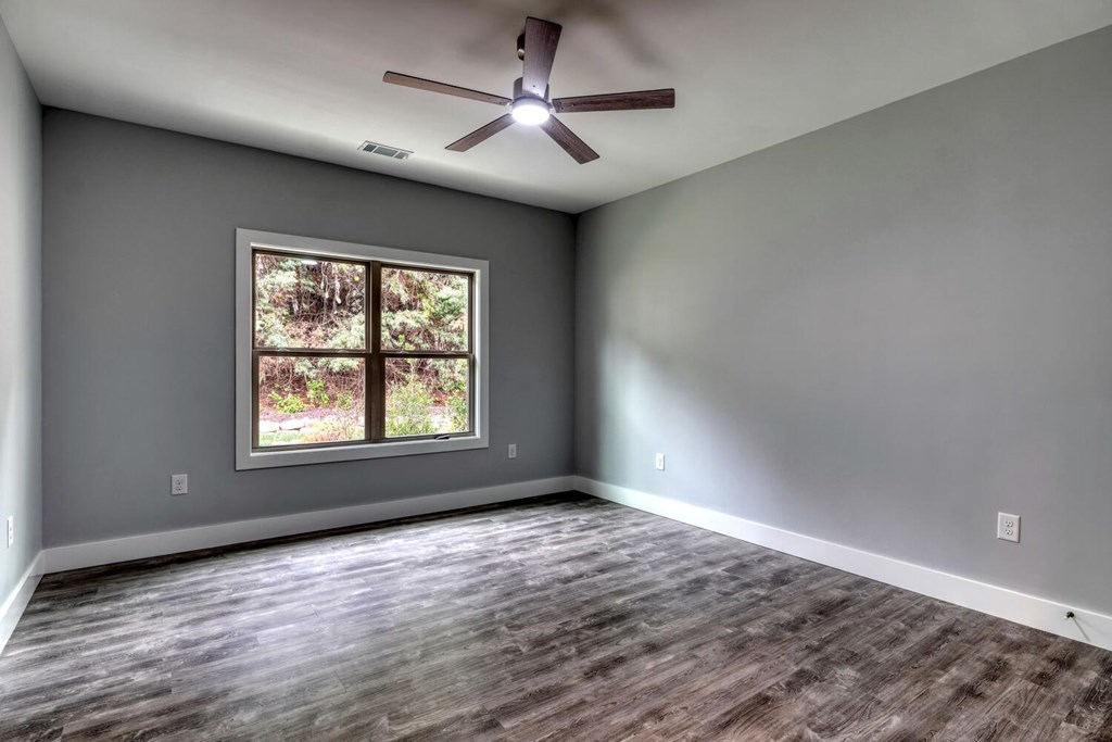 98 Brett Way Hiawassee, GA 30546 - Photo 30 of 39 wooden floor in an empty room with a window
