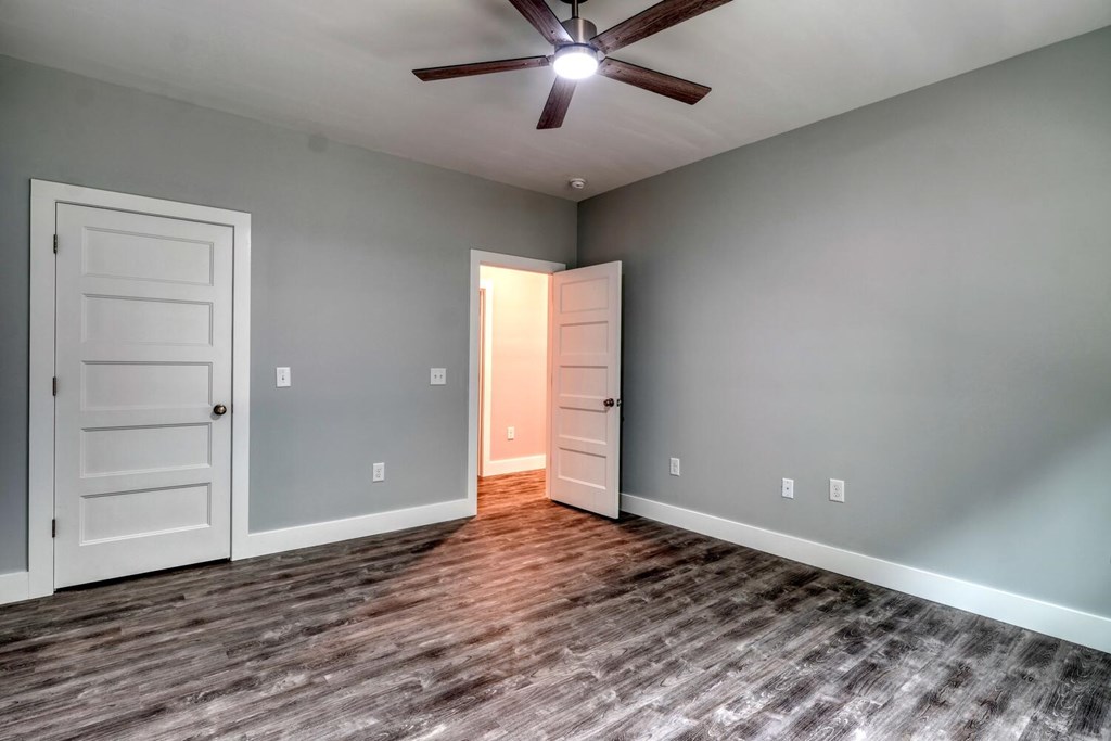 98 Brett Way Hiawassee, GA 30546 - Photo 31 of 39 a view of an empty room with window and wooden floor