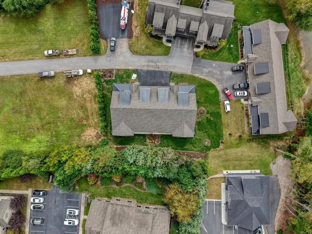 an aerial view of residential house with outdoor space and swimming pool