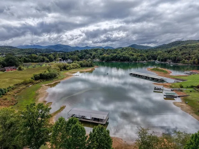 a view of a lake with houses in the back