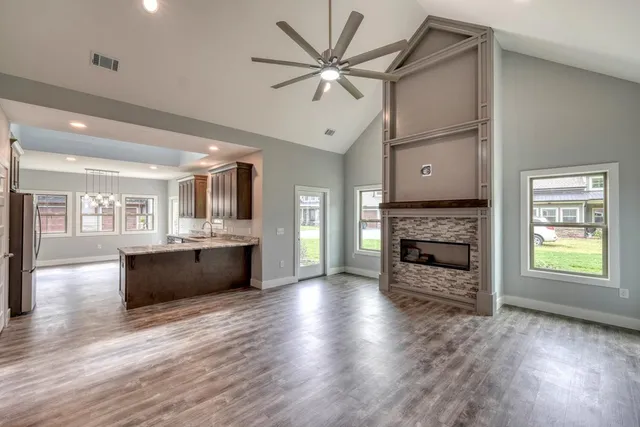 a living room with furniture and a fireplace