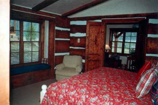 10 Arbaney Ranch Road, Unit 1/4 FRACTIONAL INTEREST Basalt, CO 81621 - Photo 7 of 7 a bedroom with a bed and wooden floor