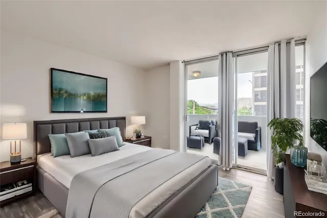 a bedroom with a large bed and a large window