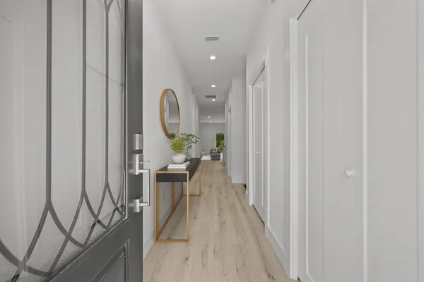 a view of a hallway with seating area