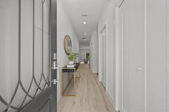 a view of a hallway with seating area