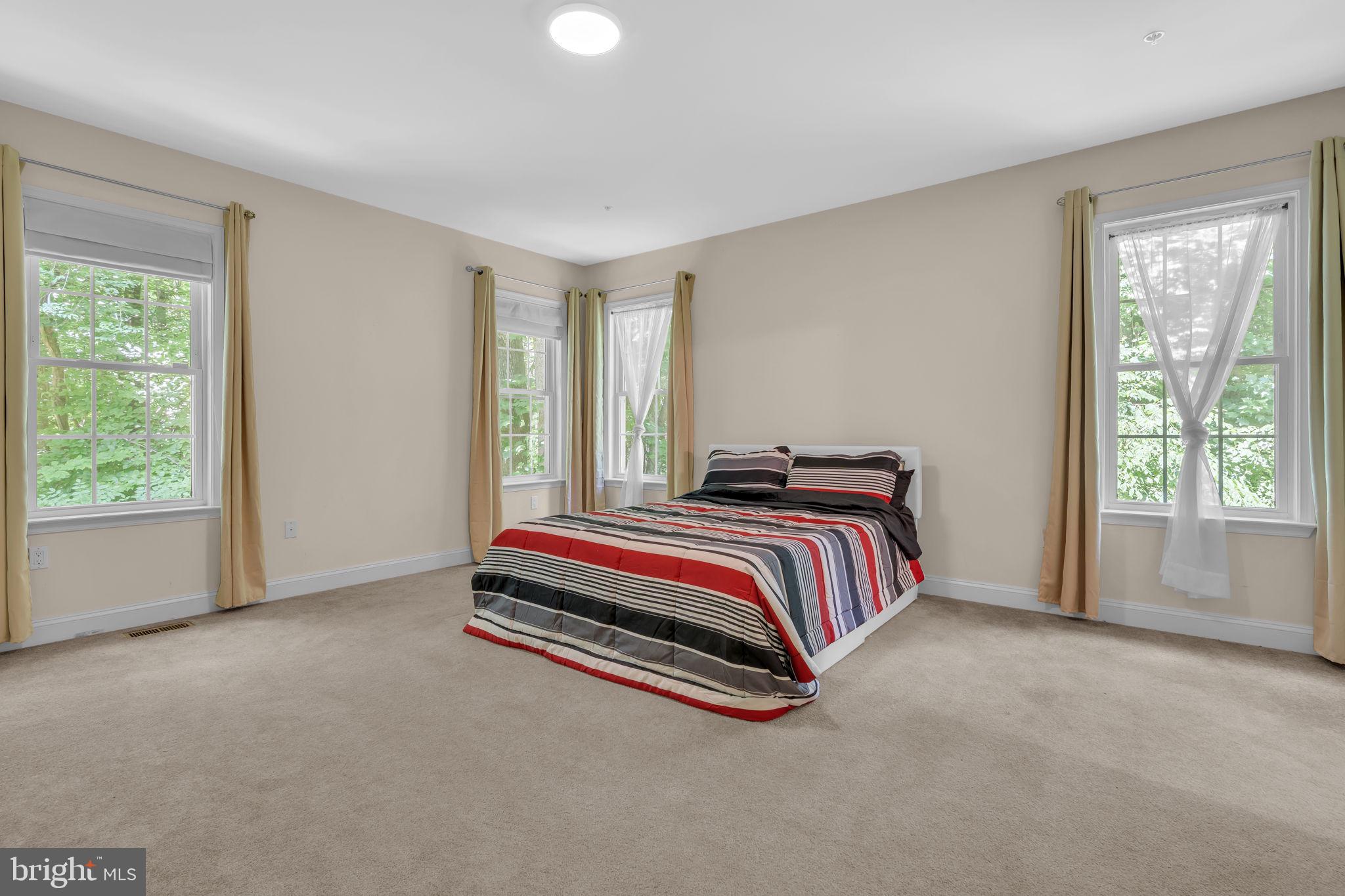 13716 Molly Berry Road Brandywine, MD 20613 - Photo 18 of 75 a bedroom with a bed and window