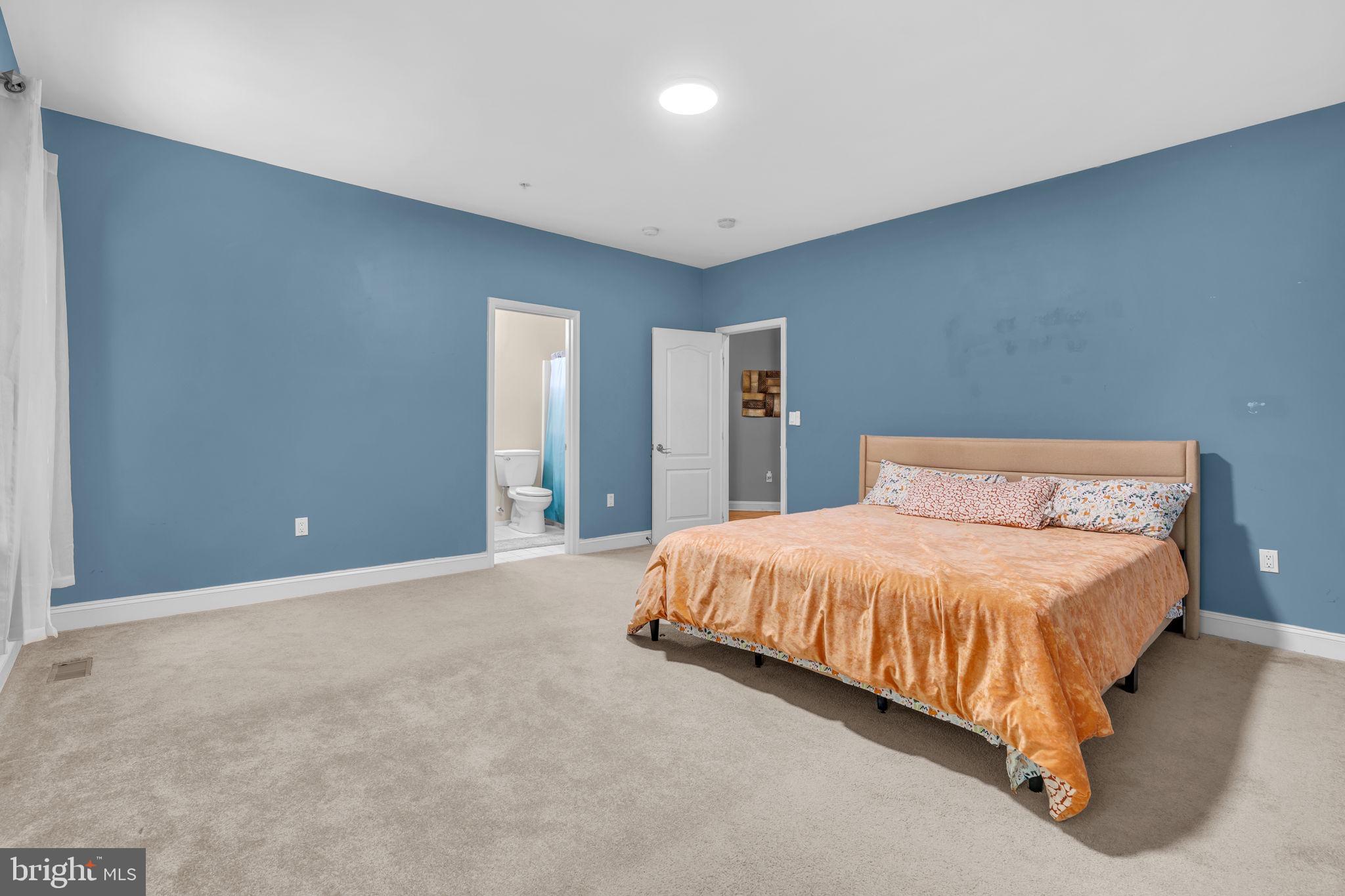 13716 Molly Berry Road Brandywine, MD 20613 - Photo 26 of 75 a large bed sitting in a room next to a lamp